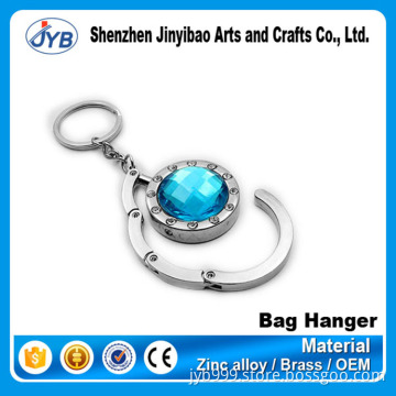 beautiful design metal round shape foldable bag hanger on table top